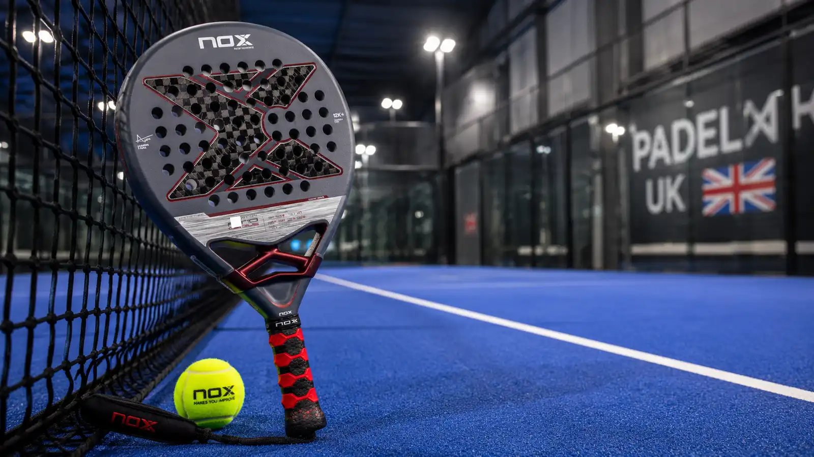 NOX AT10 Genius 12K padel racket on an indoor court